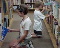 Kids kneeling in library